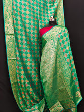 Beautiful Patola Zari Borders Green Color Silk Sarees